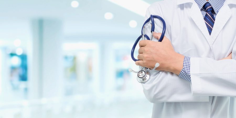 Doctor with a stethoscope in the hallway