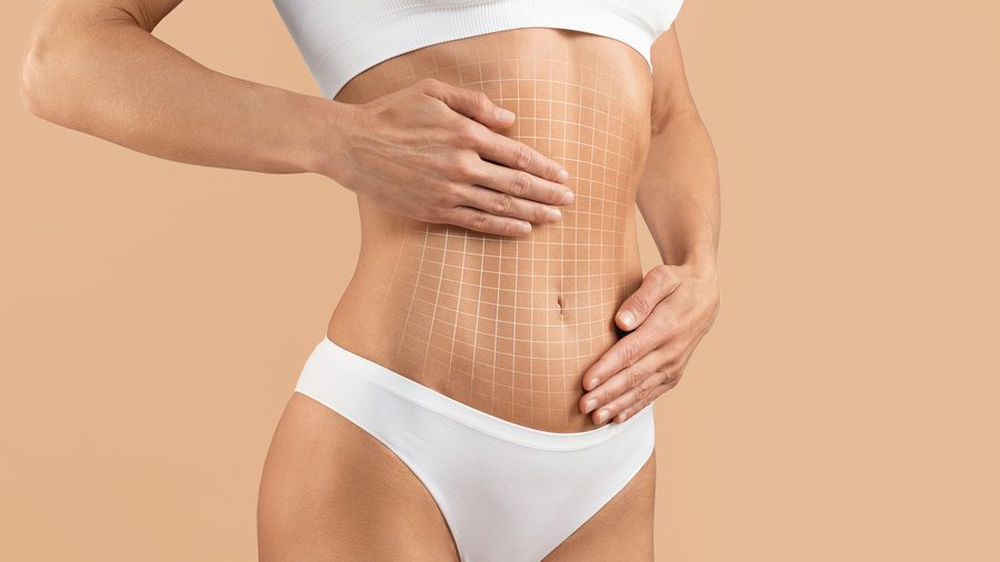 Cropped Shot Of Female Body With Flat Abdomen after tummy tuck treatment