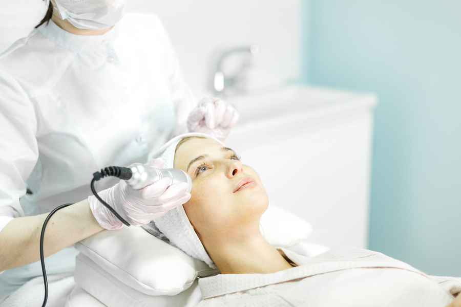 Young and beautiful girl in the clinic for non-surgical facial rejuvenation